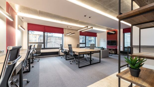 Office with tables and chairs near windows