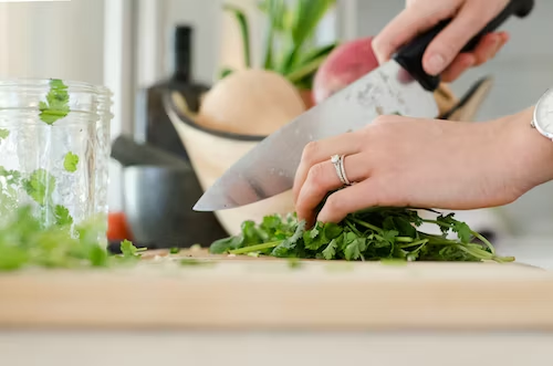 woman cutting coriander