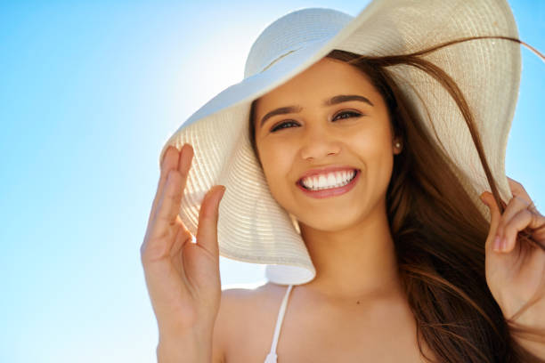 girl wearing a hat 
