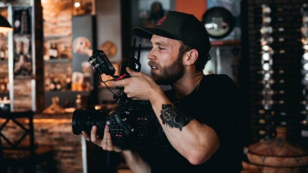 A Bearded Man Shooting a Film