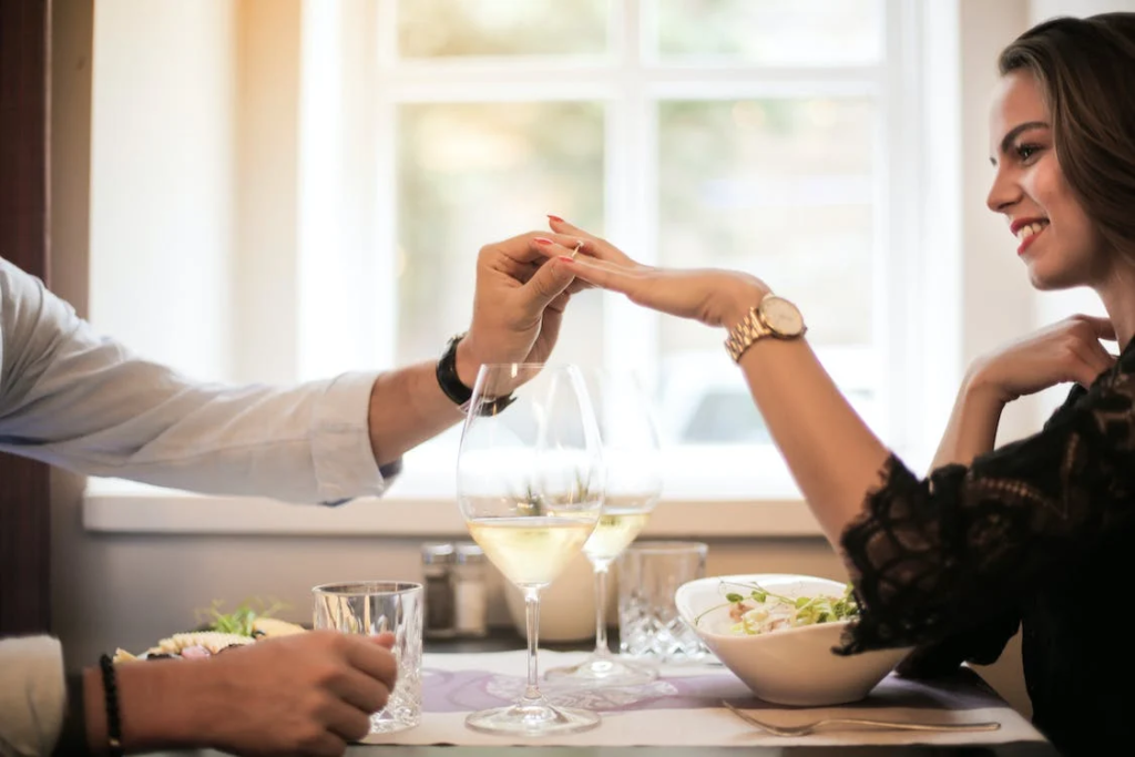 Crop man making proposal in luxurious restaurant during dinner
