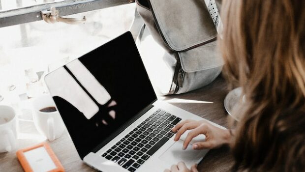 photo of a woman using her macbook