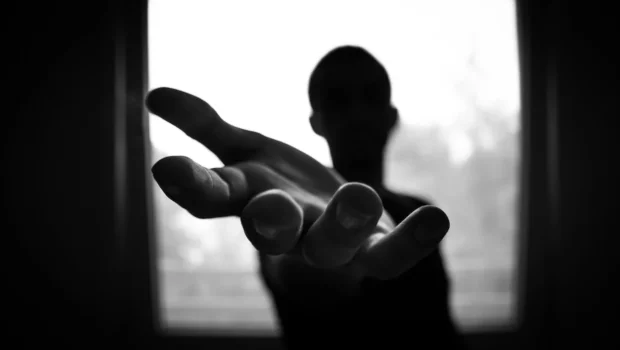 Man's Hand in Shallow Focus and Grayscale Photography