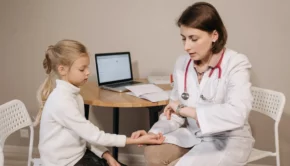 a doctor examining a child patient
