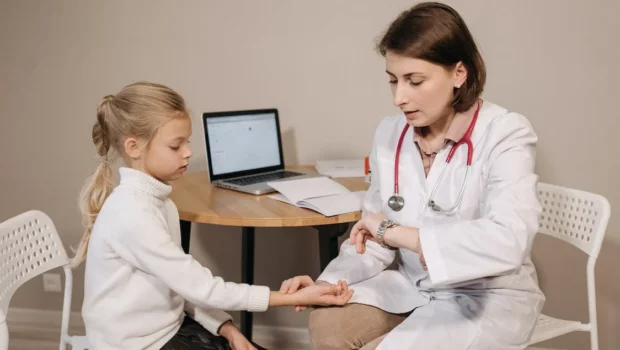 a doctor examining a child patient